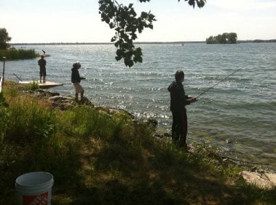 Fishing along the shoreline near Sandbanks Cottages